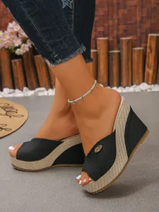 Stylish black canvas wedge sandals with woven straw platform and comfortable open toe design