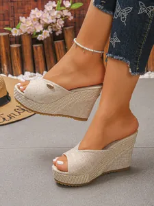 Detailed side view of beige woven wedge platform slippers for women featuring open toe design