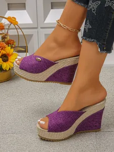 Stylish purple peep toe wedge sandals featuring a woven platform sole for summer.