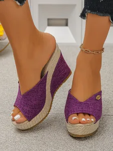 Women's stylish purple wedge sandals with platform peep toe and woven jute sole detail.
