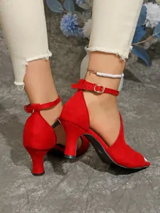 Elegant red peep-toe high-heel sandals with ankle strap buckle shown in detail on foot.