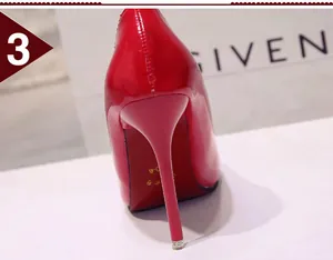 Close-up of red patent leather stiletto heel showing the sleek back view and glossy finish.