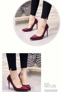 Side view of elegant burgundy patent leather pointed-toe stiletto high heels for women.
