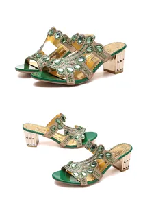 Detailed view of green rhinestone block heel sandals with emerald-colored tear-drop gems
