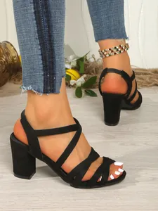 Detailed view of women's black multi-strap high heel sandals with sturdy block heel