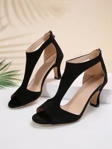Detailed view of elegant black suede peep-toe high heel sandals with back zipper