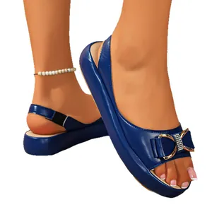 Blue platform sandals for women featuring a decorative sparkling rhinestone bow detail.