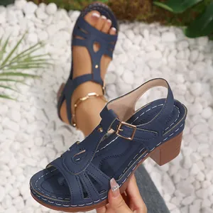 Stylish navy blue peep-toe sandals with chunky heels and elegant white stitching details