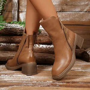 Elegant brown retro Chelsea boots featuring a sturdy block heel and side zipper