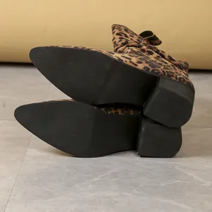 Detailed view of the anti-slip black rubber sole on leopard print ankle boots