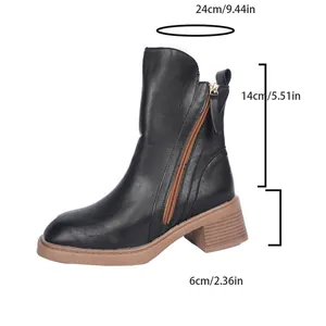Detail view of black leather ankle boot showing dimensions and heel height