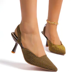 Detailed view of pointed-toe rhinestone sandals with elegant slingback and stiletto heels