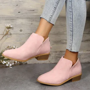 Stylish pink pointed toe Chelsea ankle boots for women with V-cut side detail on a model.