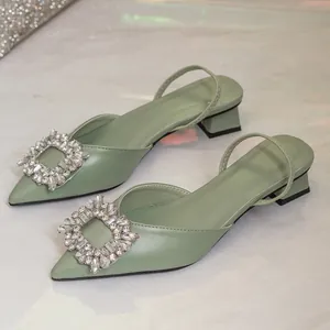 Elegant light green pointed-toe slingback sandals featuring a luxury rhinestone square buckle