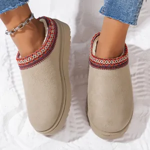 Top view of beige platform fur slippers with embroidered trim and warm plush lining