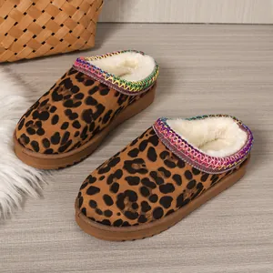 Close-up of leopard print fur-lined platform clogs with colorful trim detail