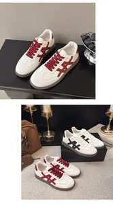 Comparison of red and black color-block thick-soled sneakers in a lifestyle setting.