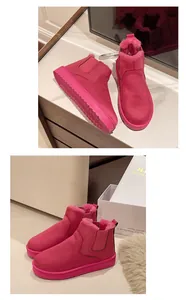 Detailed view of bright pink snow boots with cozy faux fur lining and platform sole