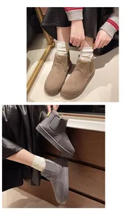 Detail showing warm fur-lined snow boots in khaki and grey with platform soles.