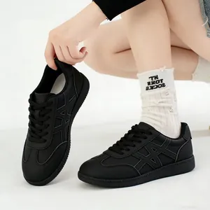 Stylish women's platform lace-up black sneakers with a round toe and side cross design