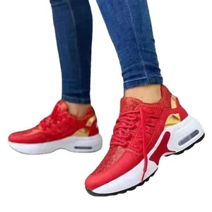 Stylish women's red chunky sneakers with breathable mesh upper and air cushion sole