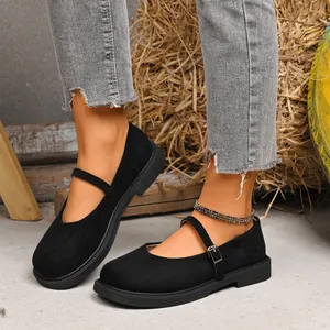 Detailed side view of black suede square toe Mary Jane flats with stylish buckle strap