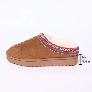 Detailed side view showing 3cm thick sole on brown suede fur-lined women winter slippers