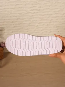 Close-up detail of the anti-slip soft sole for winter comfort mules showing texture