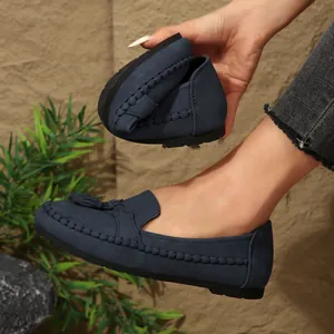 Flexible navy blue nubuck loafers for women featuring decorative tassels and soft sole