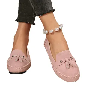 Stylish pink suede tassel loafers for women featuring comfortable flat slip-on soles