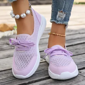 Close-up of purple mesh walking shoes for women featuring white non-slip flat soles