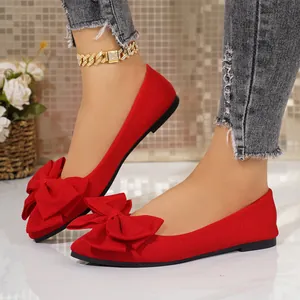 Elegant red pointed-toe flat shoes with large bow detail for women's casual wear