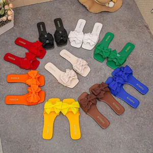 Collection of colorful women's summer flat slide sandals featuring elegant bow-knot details
