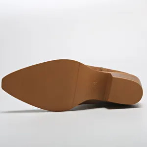 Detailed view of the durable non-slip rubber sole and chunky block heel of western boots