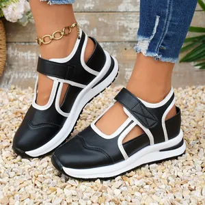 Sneaker casual da donna con zeppa bicolore bianco e nero con chiusura a strappo