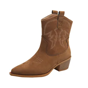 Detailed side view of women's brown suede Western boots with embroidery and chunky heel.