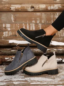 Round-toe ankle boots with side zippers shown in black, dark grey, and beige colors