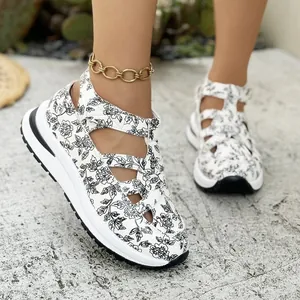 Close-up detail of stylish floral print platform sandals with a strappy design for women