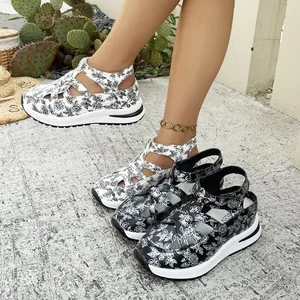 Detail view showing the floral pattern and chunky platform sole of summer sandals