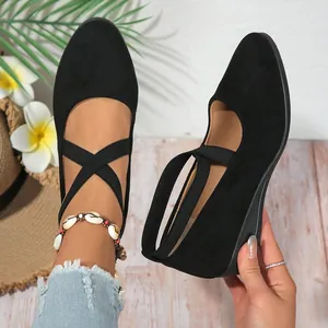 Elegant black pointed-toe wedge shoes for women featuring elastic cross strap design