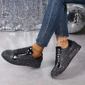 Sparkly black sequined sneakers for women with lace-up design and party-ready disco style