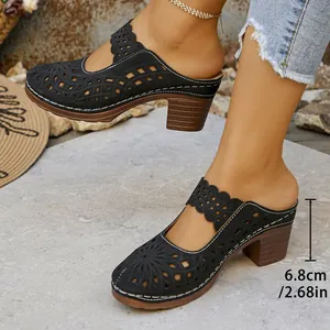 Detailed view of black cutout chunky heel mules showing 6.8cm heel height for fashion