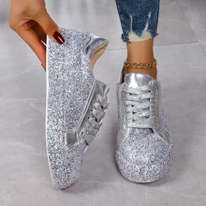 Shiny silver glitter sequin low-top sneakers for women with flat soles and lace-up design