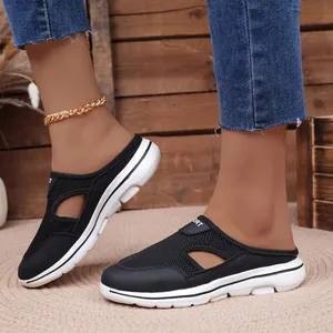 Detail view of stylish black mesh casual slip-on mules with comfortable thick soles