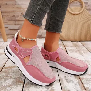 Close-up of pink breathable mesh sneakers with platform sole and velcro strap