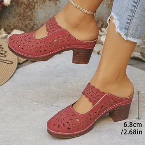 Detailed view of block heel mules with 6.8cm heel and laser-cut pattern.
