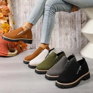 Elegant women's suede ankle boots featuring side zippers and chunky lug soles in various colors