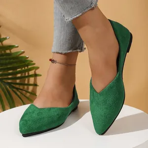 Elegant green suede pointed toe flat shoes for women in a comfortable slip-on style.