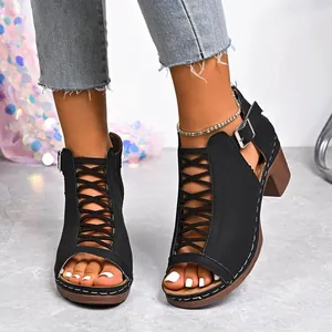 Women's black chunky heel Roman sandals featuring a peep toe and lace-up hollow design.