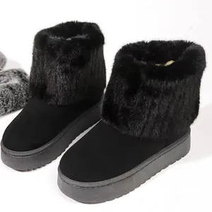 Winter black platform snow boots for women with thick faux fur trim and suede upper
